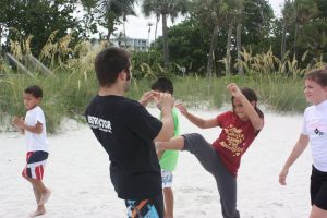 Muay Thai Kickboxing training the push kick- Naples Martial Arts Summercamp