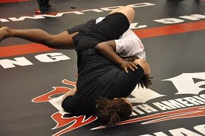 Lourdes Serrano of Team Third Law BJJ from Naples, FL hits a bump sweep in her first competition match ever at NAGA